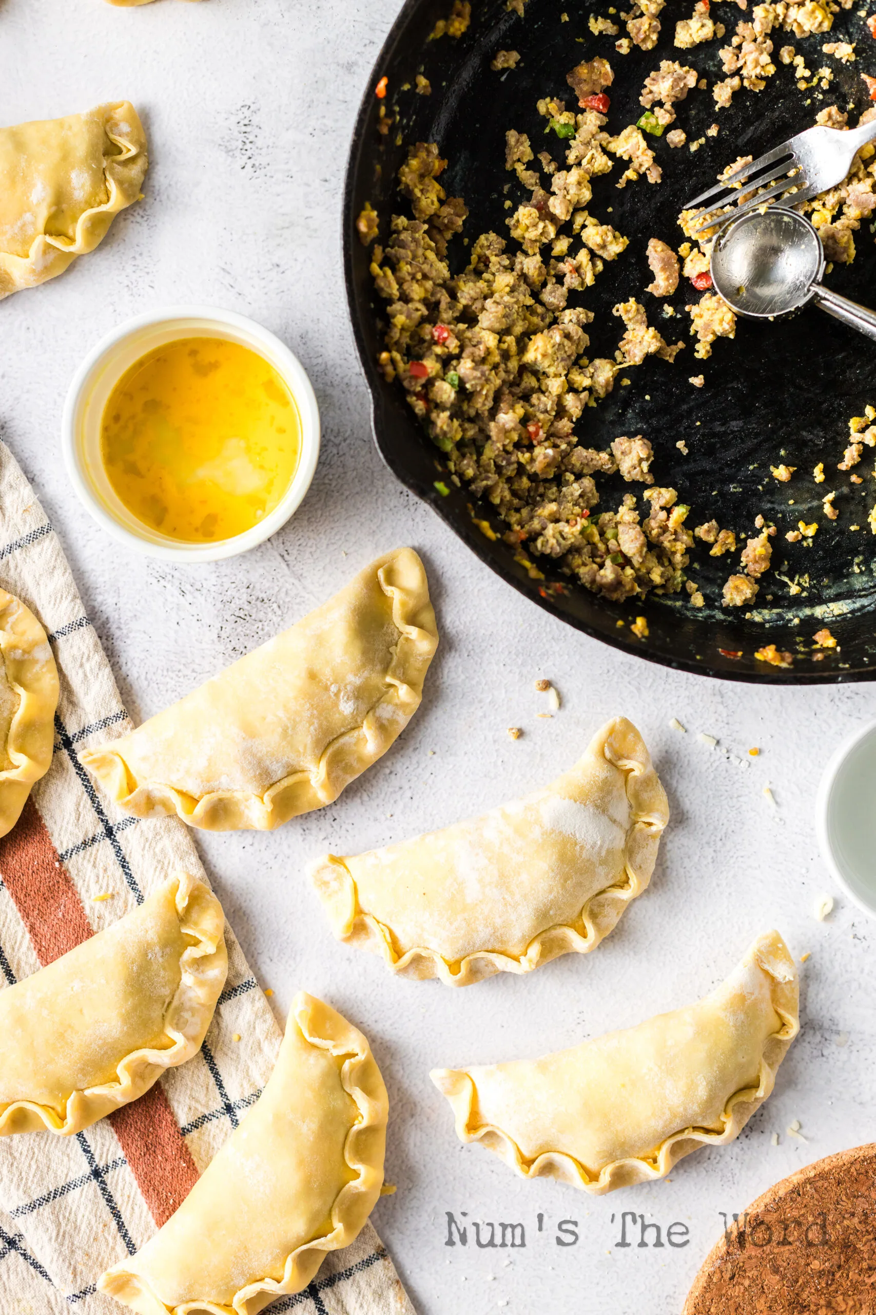 folded up filled empanadas, unbaked.
