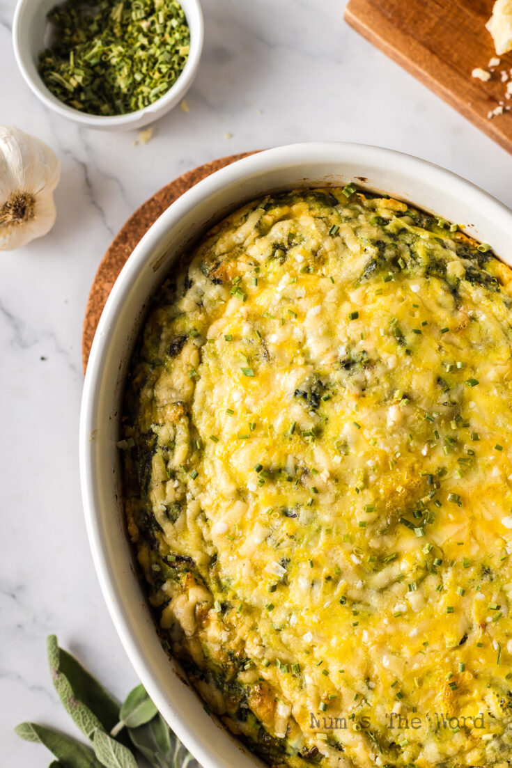 zoomed in image of frittata in casserole dish ready to serve.