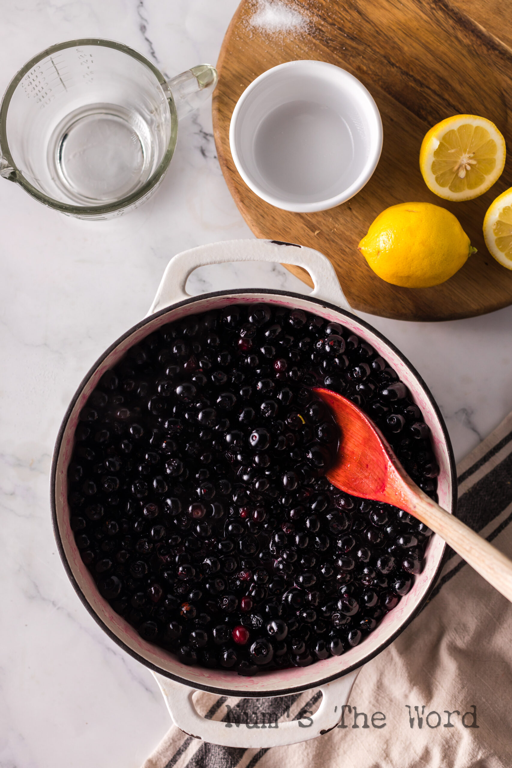 Cooking the blueberries in a pot