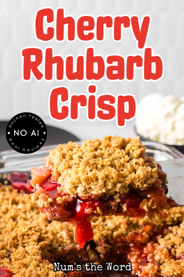 Main image for Cherry Rhubarb Crisp. A spatula is scooping a portion out.