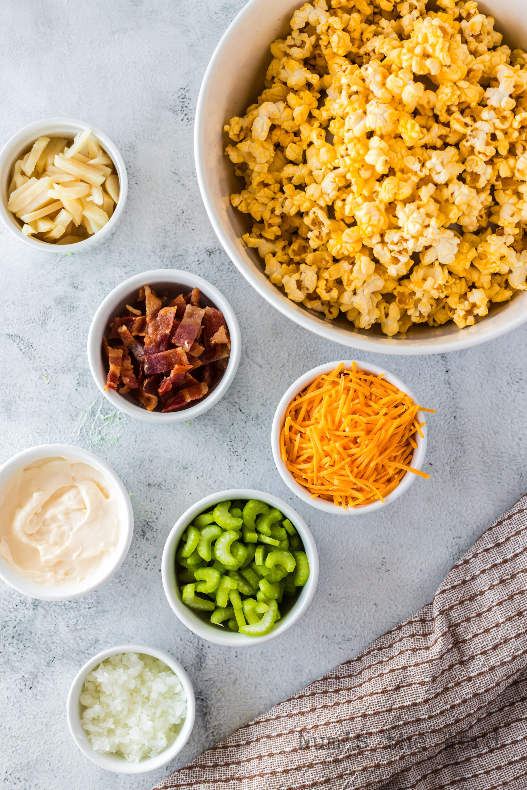 All ingredients laid out on the counter for popcorn salad.
