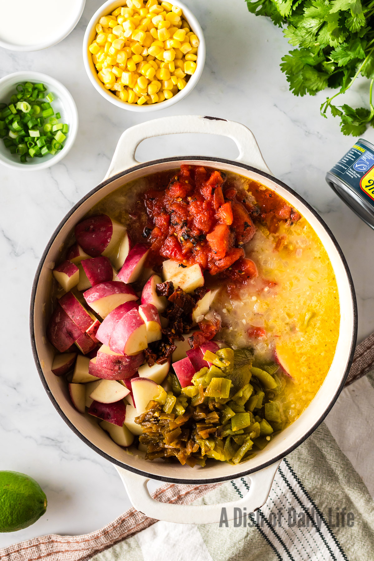 potatoes, tomatoes, peppers and chipotle pepper in adobo added to soup pot.
