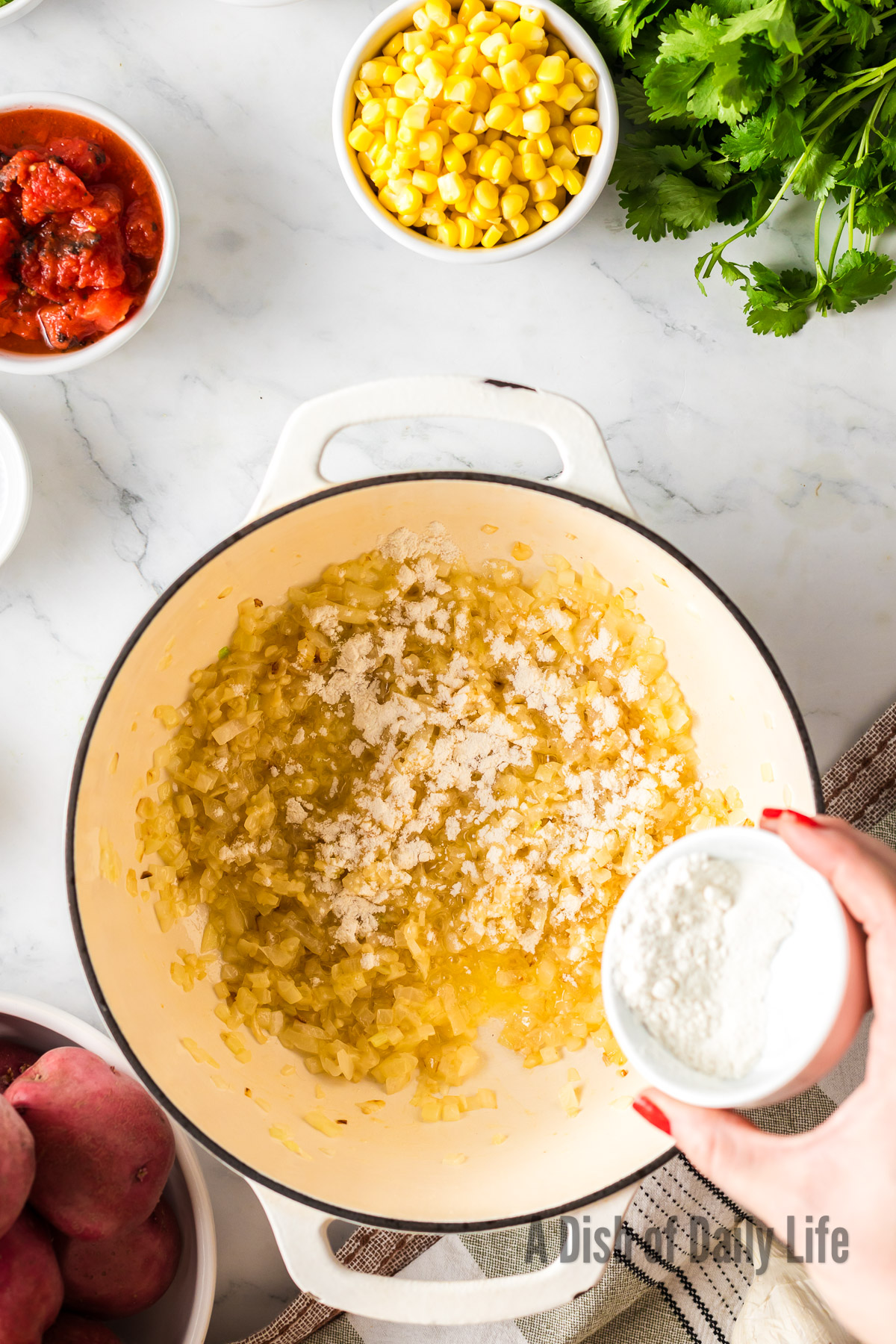 Garlic and flour added to onion mixture.